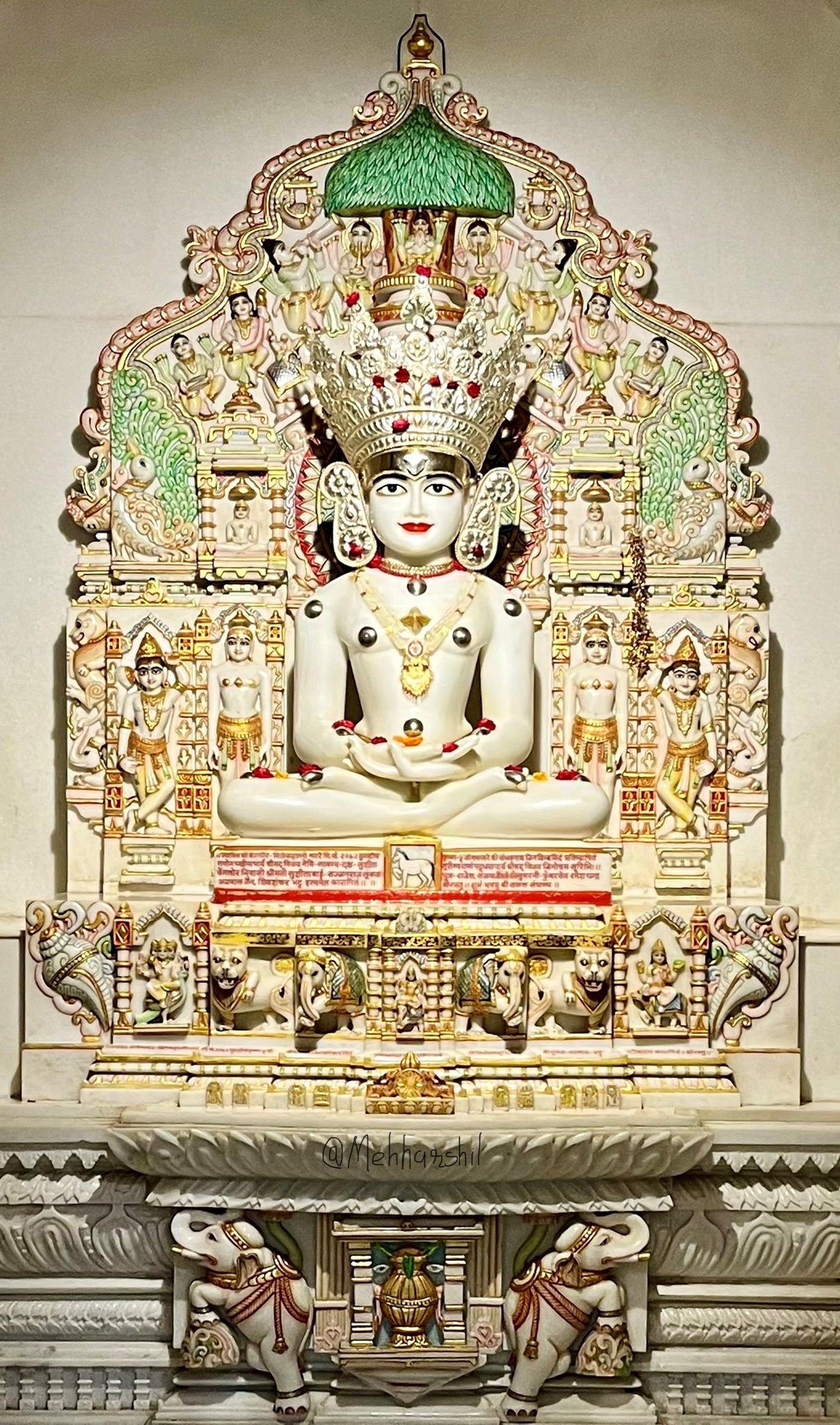 Sacred idol of Sambhavnath Bhagwan, Third Tirthankara of Jainism, in meditative posture beneath an ornate temple canopy